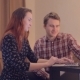 Young Couple Discussing Internet Shopping a Laptop - VideoHive Item for Sale