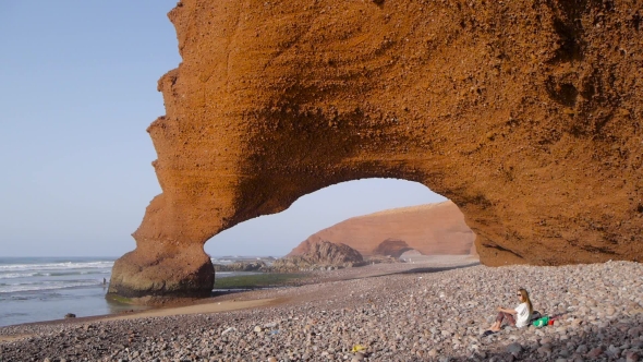 Girl Relaxing On Legzira Beach, Morocco