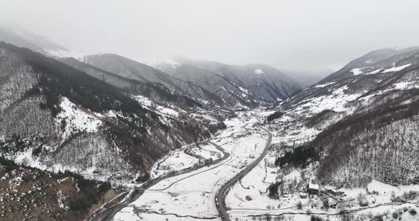 Aerial view of beautiful snowy mountains in Pasanauri, Georgia