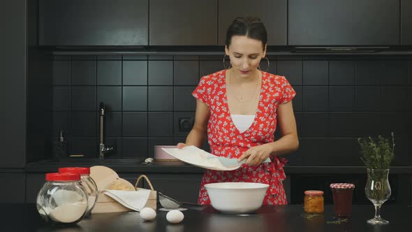 Woman cooking homemade cookies and mixing ingredients in modern home kitchen, Food concept