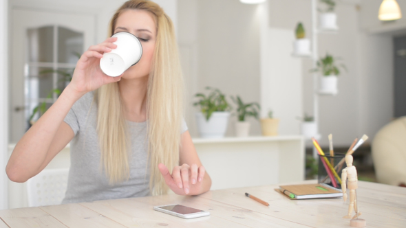 Girl Drinking Coffee , Using Phone alt