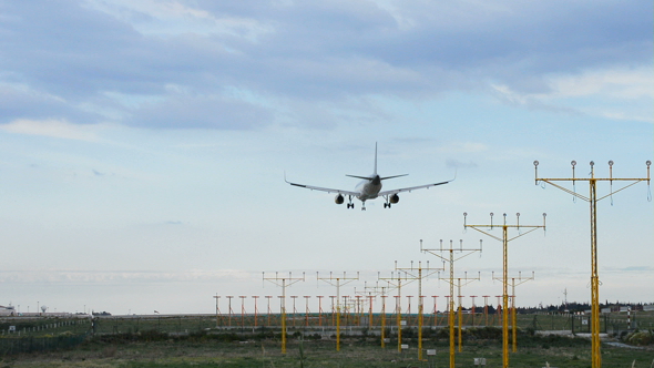 Airplane Landing in Airport Runway