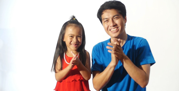 Asian Father And Daughter Clapping Hands