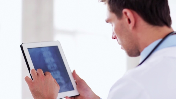 Doctor With X-ray Scan On Tablet Pc 45