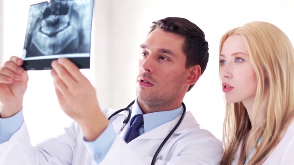 Two Doctors Discussing X-ray Image At Hospital 40