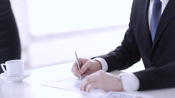 Businessman Hands Signing Papers 6