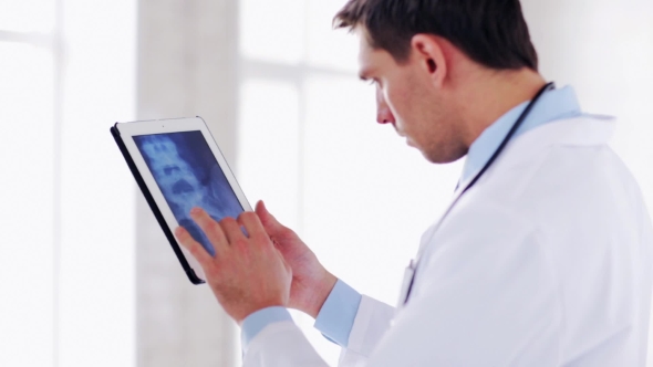 Doctor With X-ray Scan On Tablet Pc 44