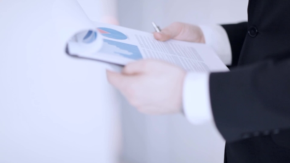 Businessman Hands Checking Documents 11