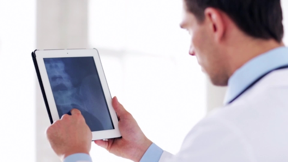 Doctor With X-ray Scan On Tablet Pc 46