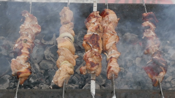 Meat Fried On a Grill Outdoors In Winter