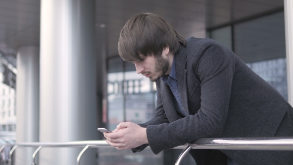 Freelancer with Smartphone, Young Businessman In Airport. 