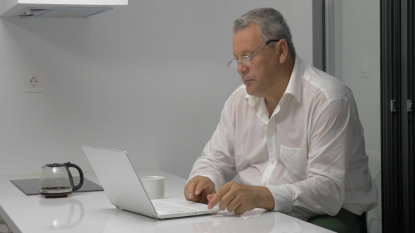 Busy Businessman Working In Office