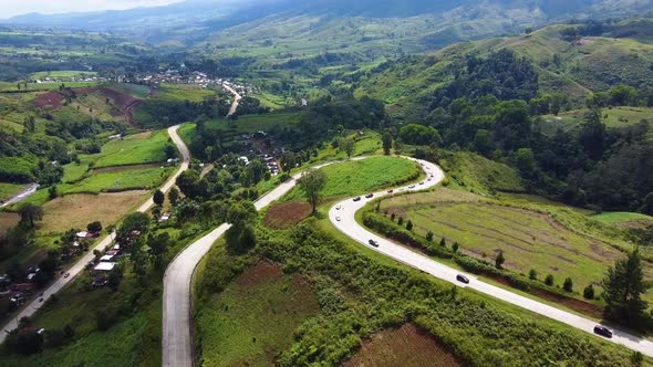 Winding road on a mountain with cars