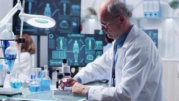 Chemist Looking at a Red Sample