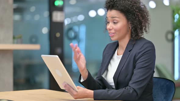 African Businesswoman Doing Video Chat on Tablet 