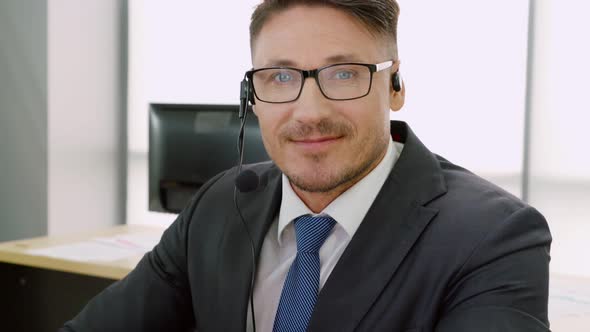 Business People Wearing Headset Working in Office