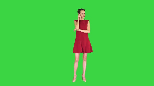 Cute Pretty Lady Talking on Mobile Phone on a Green Screen, Chroma Key