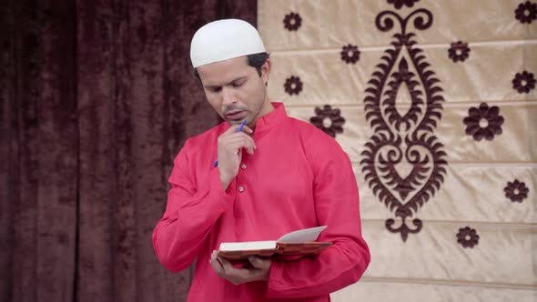 Muslim poet thinking and writing poem