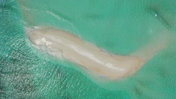 Aerial view scenery of perfect island beach break by transparent water with white sandy background o