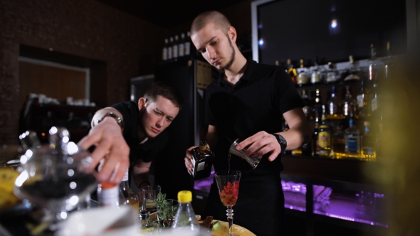 Bartender Is Making Cocktail At Bar Counter, Night Club