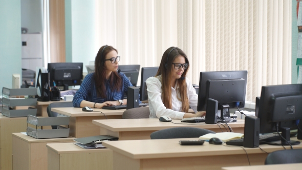 Women Working In a Call Center With Customers