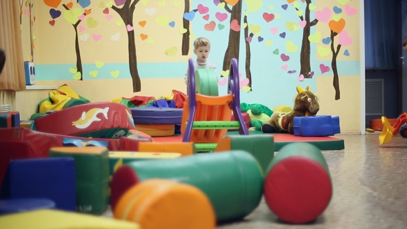 Little Boy Playing in the Playroom