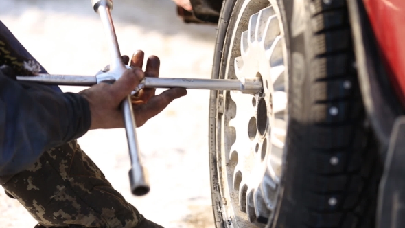 Worker Untwists Wheel