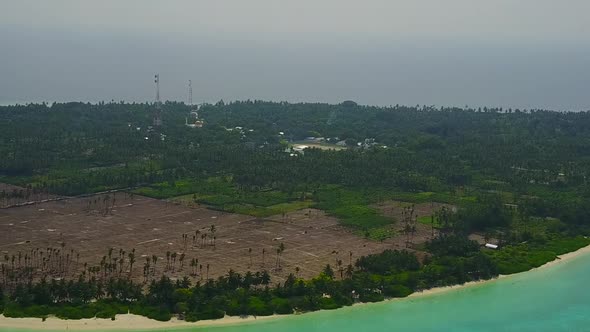 Aerial drone travel of coastline beach by blue ocean with sand background