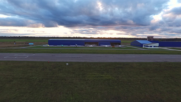 Small Airplanes Near Hangar