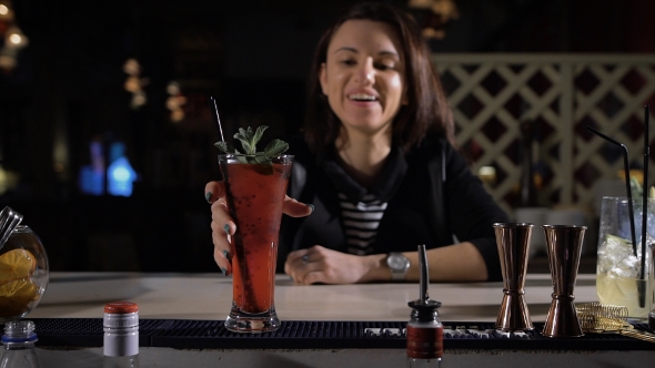 The Bartender Makes An Exclusive Cocktail For The Attractive Brunette