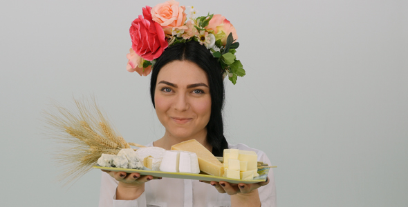 Woman Lifting A Cheese Platter