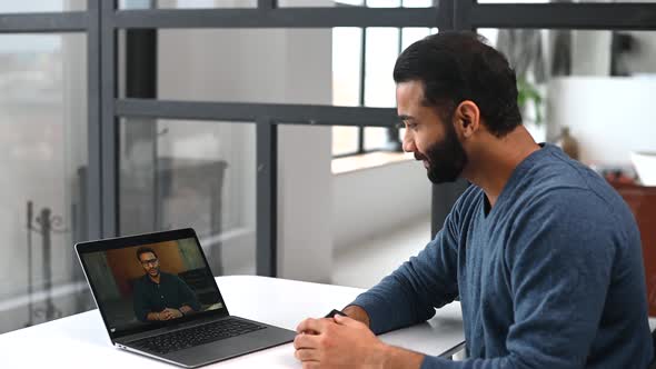 Two Male Indian Colleagues Talks Via Video Call