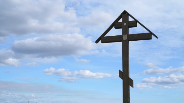 Orthodox Cross On a Background Of Floating Clouds