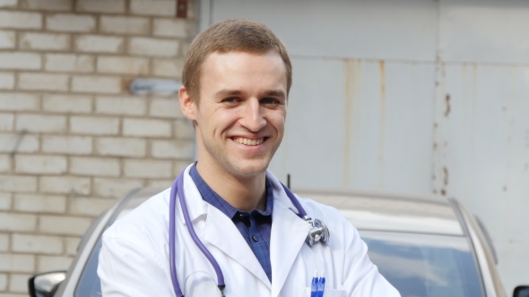Portrait Of Young Caucasian Medical Doctor Smiling Outdoor