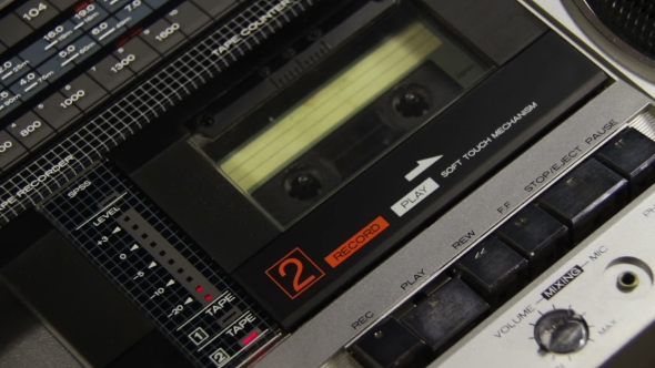 Insert Audio Cassettes Into The Tape Player