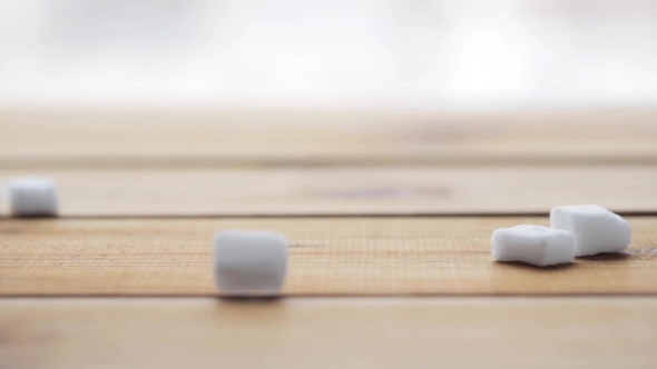 White Lump Sugar Pouring On Wooden Board Or Table 29