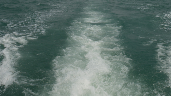Sea Water Trails Behind Boat  alt