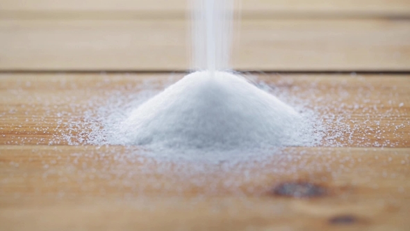 White Sugar Pouring Into Heap On Wooden Table 77