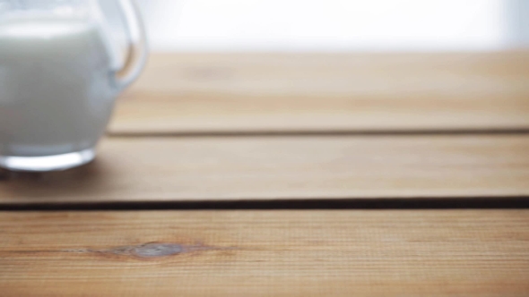 Sugar Falling Into Cup Of Coffee On Wooden Table 70