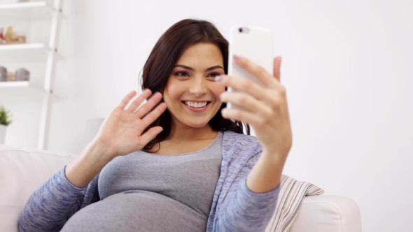 Pregnant Woman In Smartphone Video Chat At Home 82