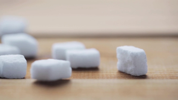 White Lump Sugar Pouring On Wooden Board Or Table 32