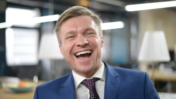 Portrait of Laughing Businessman