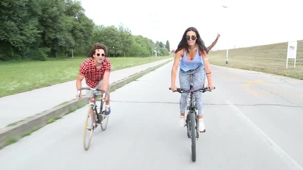 Three Young Adults Having Fun Cycling 5