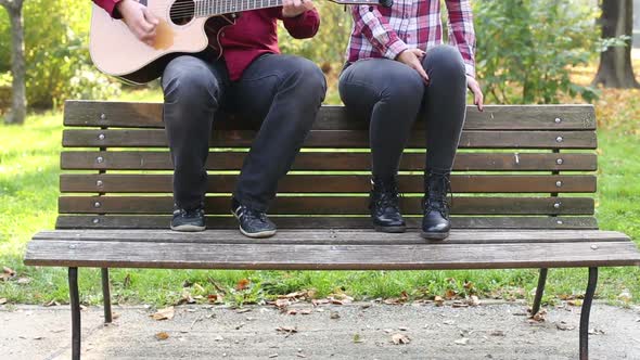 Man Playing Guitar While Woman Singing 8