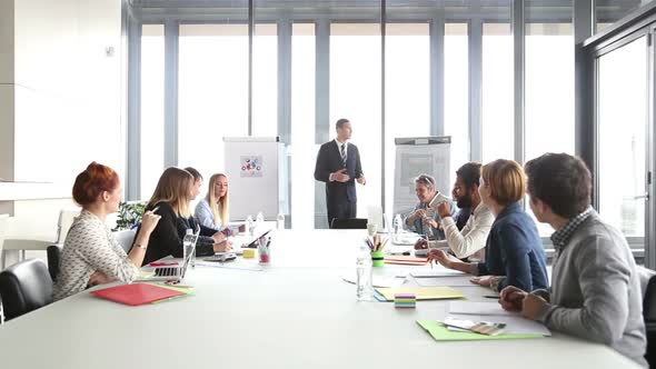 Business People Applauding Director During A Meeting 1
