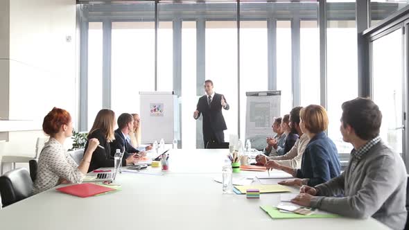 Business People Applauding Director During A Meeting 2