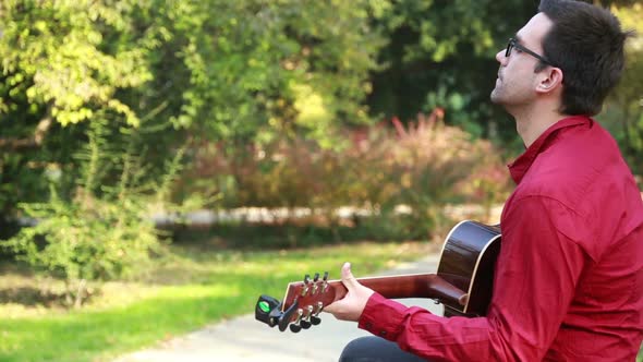 Man Playing The Guitar And Singing 3