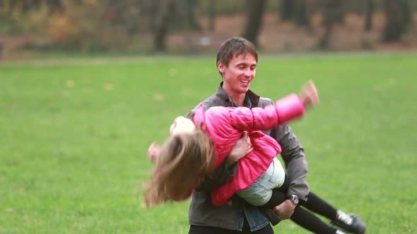 Young Dad Playing With Daughter In Park 2