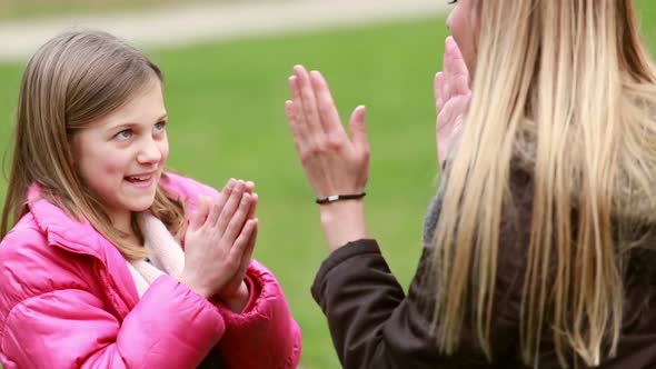 Mom And Daughter Playing Clapping Game 1