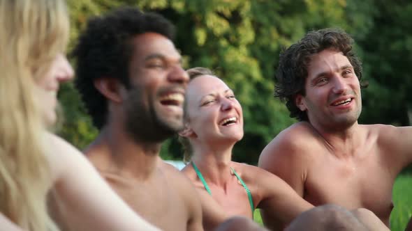 Four Friends Laughing While Sitting In Nature 1